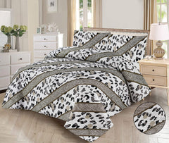 Leopard print comforter set on a bed in a bedroom setting