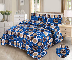 Blue and brown patterned bedspread set on a bed in a bedroom.