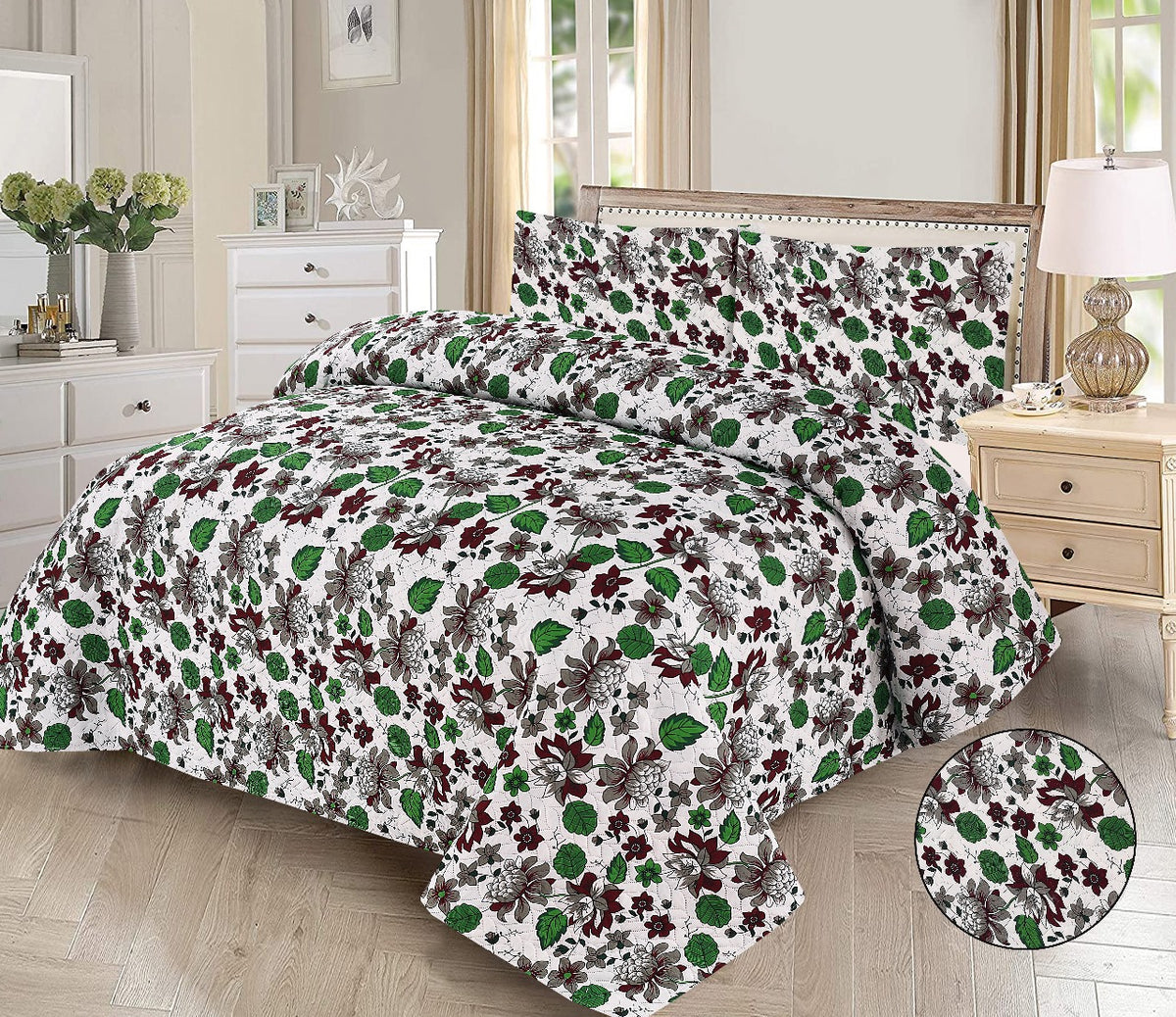 Floral patterned comforter set on a bed in a bedroom setting