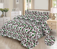 Floral patterned comforter set on a bed in a bedroom setting